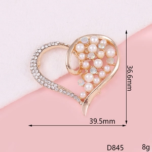 Macro shot of 36.6mm hollow heart alloy charm with pearls, rhinestones, and colorful gems