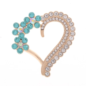 Exquisite gold heart brooch with colorful rhinestones and floral pattern on white backdrop