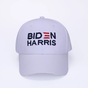 Close-up of Biden Harris embroidery on white cotton baseball cap with striped details