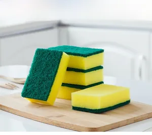 Close-up of five dual-sided kitchen sponges with green fiber and yellow foam surfaces
