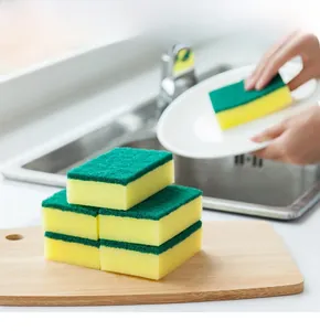 Close-up of double-sided dish sponge with green scouring pad and yellow sponge layer