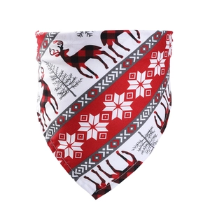 Close-up of reindeer prints and red plaid pattern on the Christmas pet bandana fabric