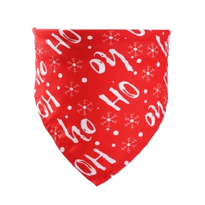 Close-up of red cotton Christmas dog bandana with white Ho Ho Ho and snowflake print