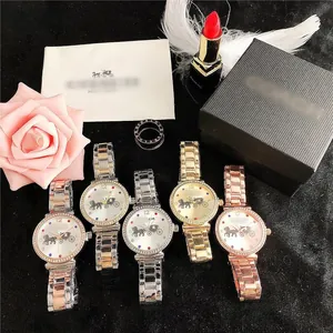 Detail of luxury fashion watches with crystal bezel and steel strap in various colors