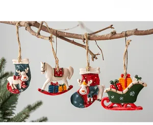 Set of four vintage resin Christmas ornaments featuring reindeer socks and a rocking horse