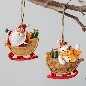 Christmas tree hanging ornaments featuring Santa and Snowman on sleighs with gift boxes