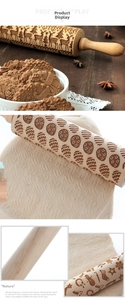 Detail showing laser-engraved Christmas patterns on a natural wooden rolling pin