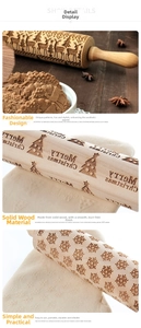 Detail of Christmas wooden rolling pin with reindeer and snowflake embossed patterns