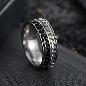 Macro view of double-layered rotating chain ring in black and silver stainless steel