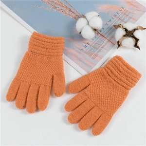 Children's winter warm orange knitted full finger gloves with ribbed cuffs on white