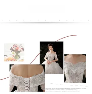 Detail of off-shoulder lace wedding dress with sequin floral embroidery and lace-up back