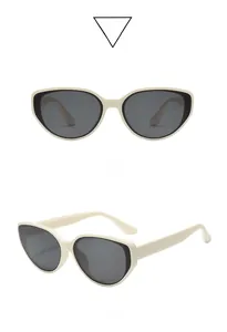 Detailed front and side view of cat eye polarized sunglasses with cream frames and gray lenses