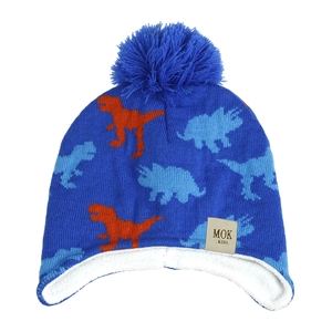 Close-up of knit texture and dinosaur pattern on the blue winter hat with pom-pom
