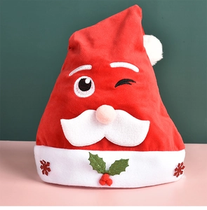 Detail of red plush Christmas hat with Santa embroidery and festive holly leaf patterns