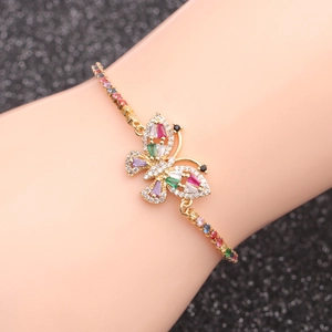 Elegant gold butterfly bracelet with vibrant multicolored cubic zirconia on a wrist