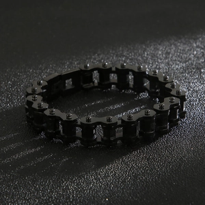 Detail of masculine black stainless steel biker chain bracelet with mechanical links