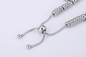 Detail of adjustable slider clasp on silver snake chain bracelet for women