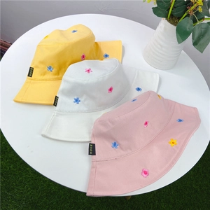 Women's summer cotton bucket hats with floral embroidery in yellow, white, and pink