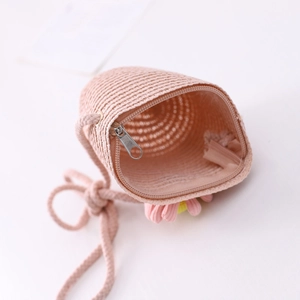 Pink straw woven crossbody bag for girls with floral decoration and zipper closure