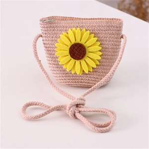 Detail of pink straw crossbody bag with large yellow sunflower and zipper closure