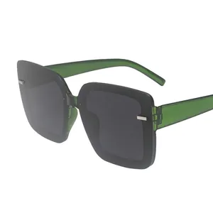 Fashion oversized square sunglasses with translucent green frames and dark grey lenses