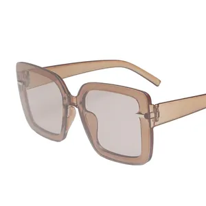 Fashionable oversized square sunglasses with amber resin frames and tinted lenses