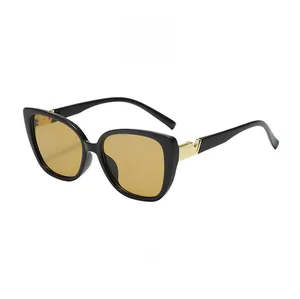 Side view of square oversized sunglasses with black frames and yellow amber lenses