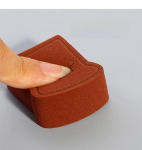 Close-up of toast-shaped makeup sponge showing quick rebound and soft texture