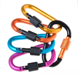 Close-up of five colorful D-ring locking carabiners in orange, gold, blue, purple, and black