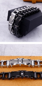 Detail of silver and black stainless steel motorcycle chain bracelet with inlay stones