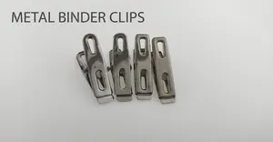 Detailed view of four stainless steel flat clips for clothes drying and organizing
