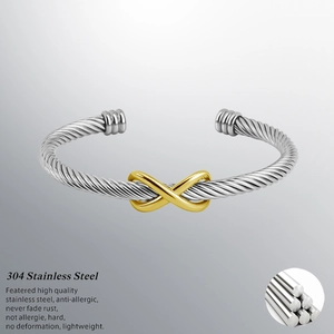 Two-tone silver and gold stainless steel wire cuff bracelet with infinity knot charm