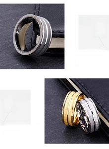 Detail of brushed gold and silver punk style wide rings with polished inner bands
