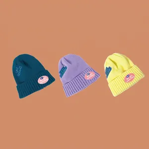 Three-piece set of ribbed knit beanies with Love Dreams embroidery and pink patches