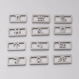 Twelve silver stainless steel zodiac pendant charms with square cutout designs