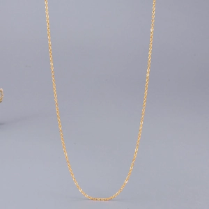 Minimalist 18K rose gold stainless steel cross chain necklace on a grey background
