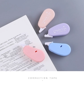 Macro view of four Morandi color correction tapes with protective white dust caps