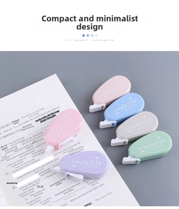 Close-up of five mini Morandi correction tapes in pastel colors on a notebook