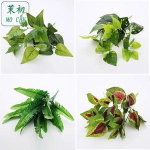 Detail of silk eucalyptus and money leaves showing realistic textures and vivid colors