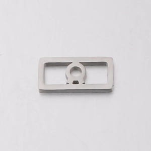 Macro view of a square stainless steel 12 zodiac pendant with hollow cutout design