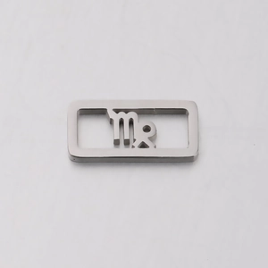 Macro shot of silver stainless steel square pendant with Virgo constellation cutout