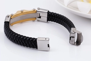 Detail of multi-strand braided leather bracelet with tri-color metallic clasp finish