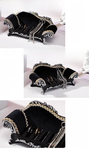 Detailed macro view of large black velvet classic sofa jewelry organizer for rings and earrings