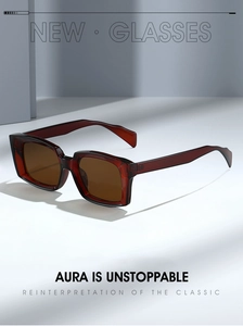 Detail of dark red translucent square sunglasses with brown UV protection lenses