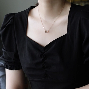 Elegant 18K gold plated titanium butterfly pendant necklace for women on a model neck