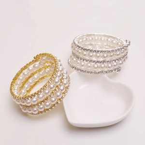 Multilayer wrap bracelet with pearls and rhinestones in gold and silver finish