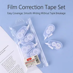 Minimalist clear white correction tape set with transparent storage pouch on blue background