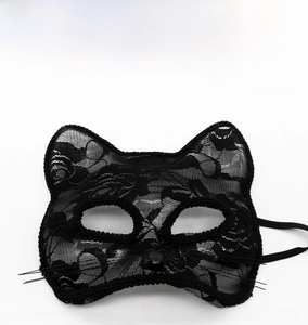 Close-up of black lace cat mask featuring intricate floral patterns and heart detail
