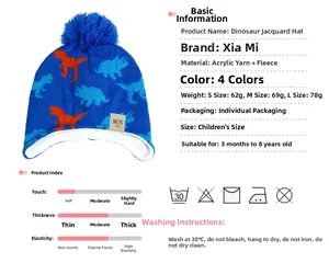 Detail view of the warm fleece lining and orange dinosaur jacquard on the blue knitted hat