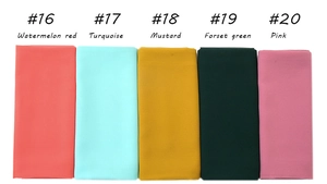 Flat lay of five lightweight pearl chiffon scarves in pink, green, yellow and red shades